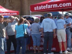 June 2008--A crowd of classic car owners waiting at the State Farm Poker Run Booth to draw their poker card at the Cruzin' Havana Car Show & Poker Run.